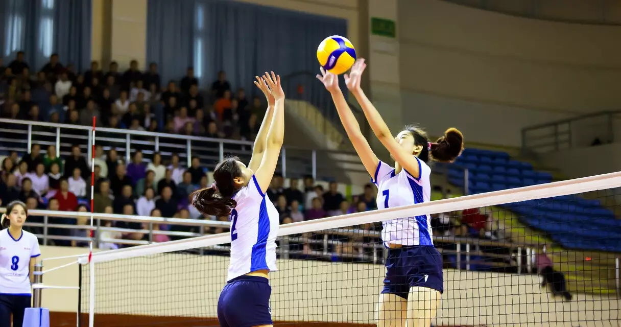 Volleyball players inside a large arena in the Philippines
