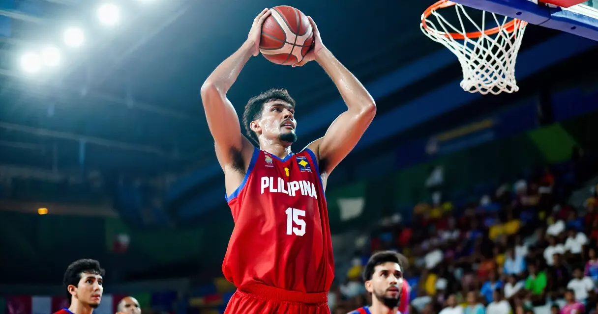 A powerful center player posting up inside the PBA arena