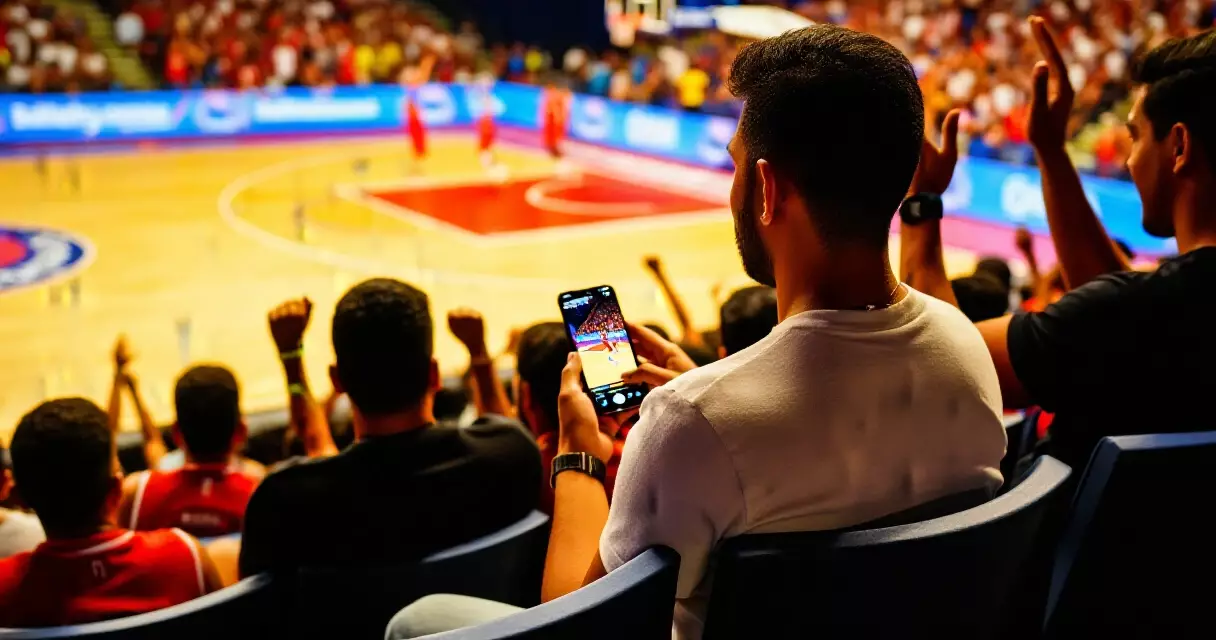 Filipino basketball fan in the arena watching a live PBA game