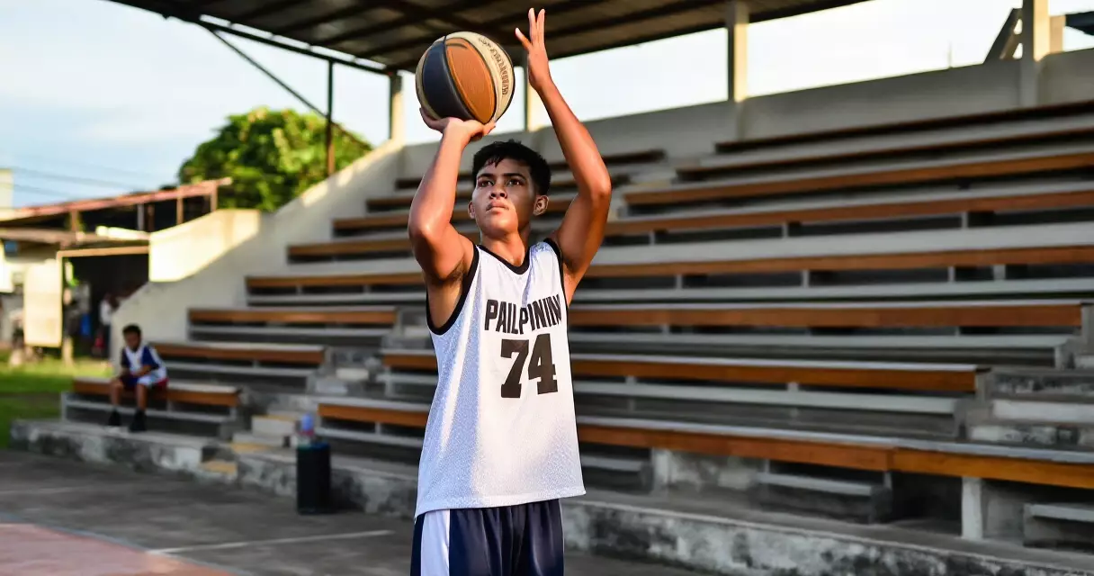 Young Filipino basketball player training outside the court in the Philippines